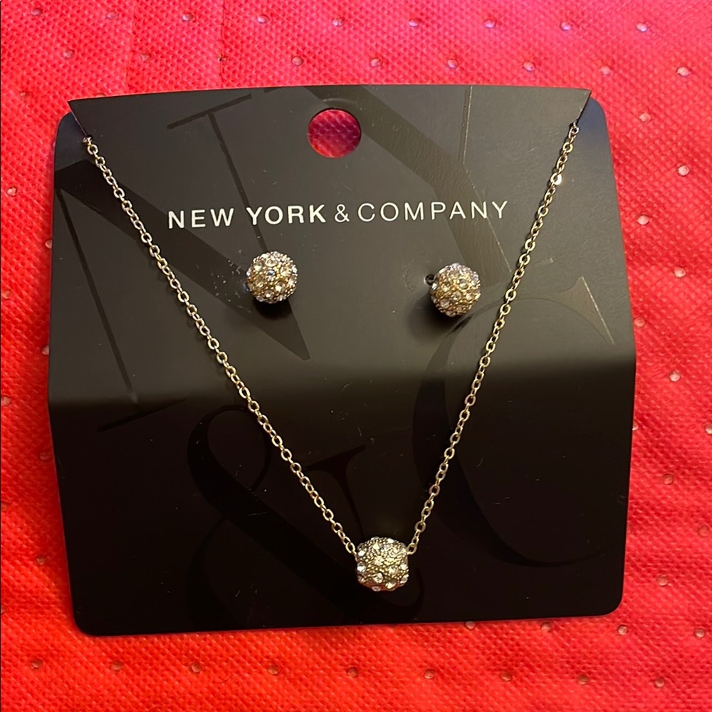 New York & Company gold toned with Crystal Earrings & necklace